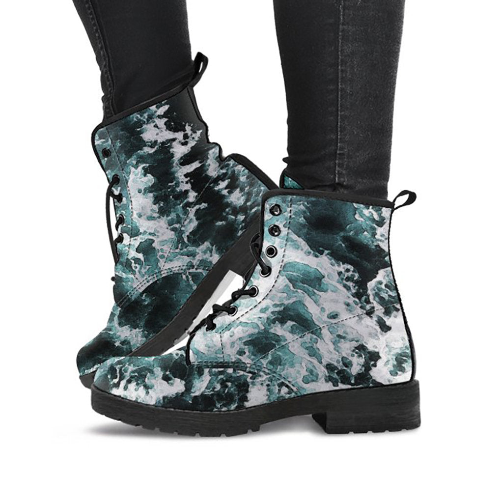 Dark teal printed boots with abstract ocean wave artwork